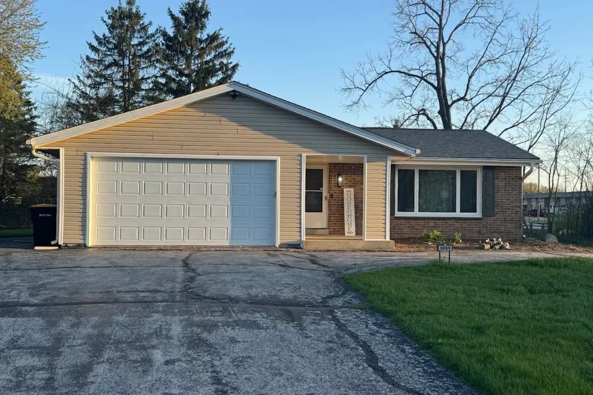Completed roof replacement on a Menomonee Falls, WI ranch with an attached garage