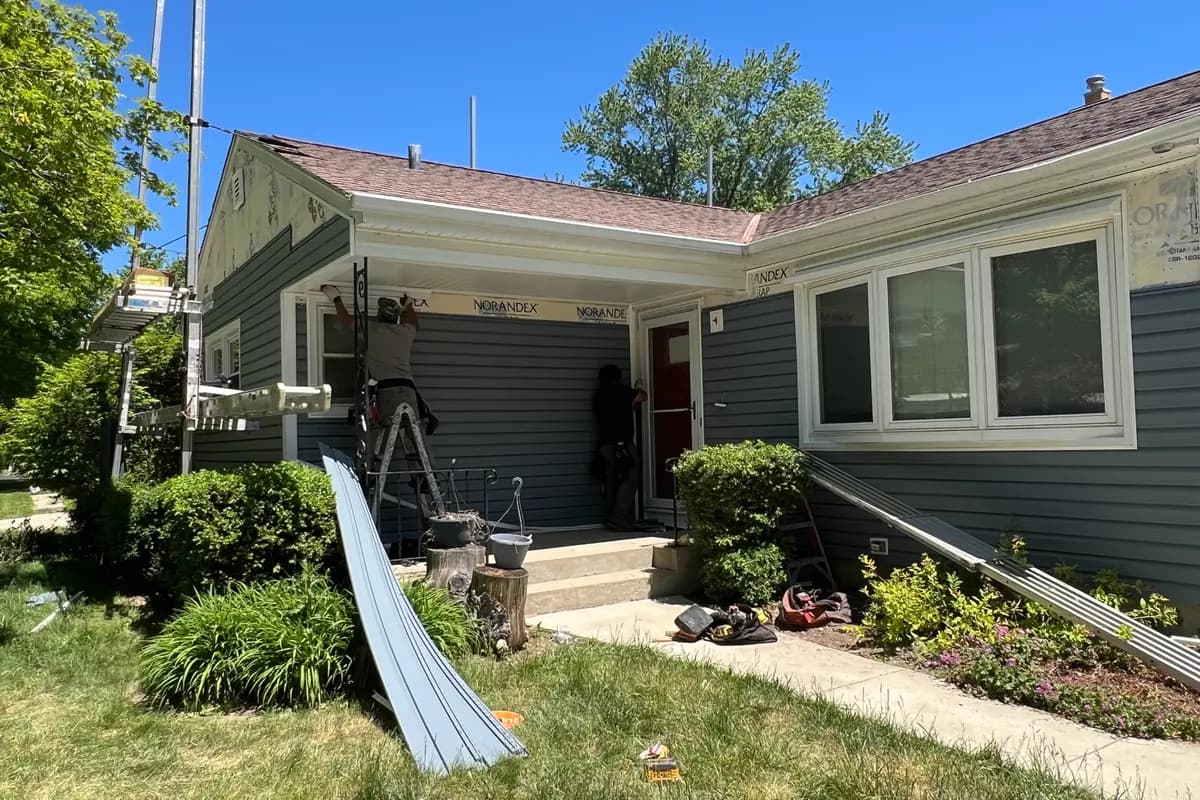 Roofing materials staged outside a Pewaukee, WI home during an Apexium Roofing replacement