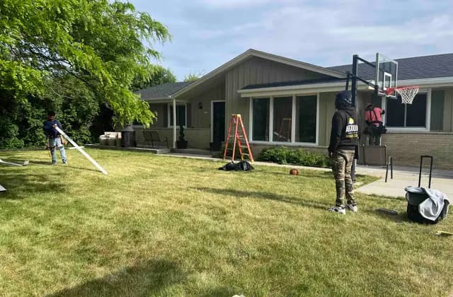 Apexium Roofing crew setting ladders to begin a free roof inspection in Grafton, WI