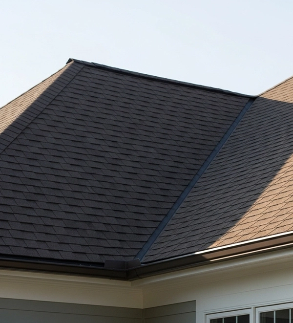 Residential home with clean shingle roofing for Apexium Roofing service page.