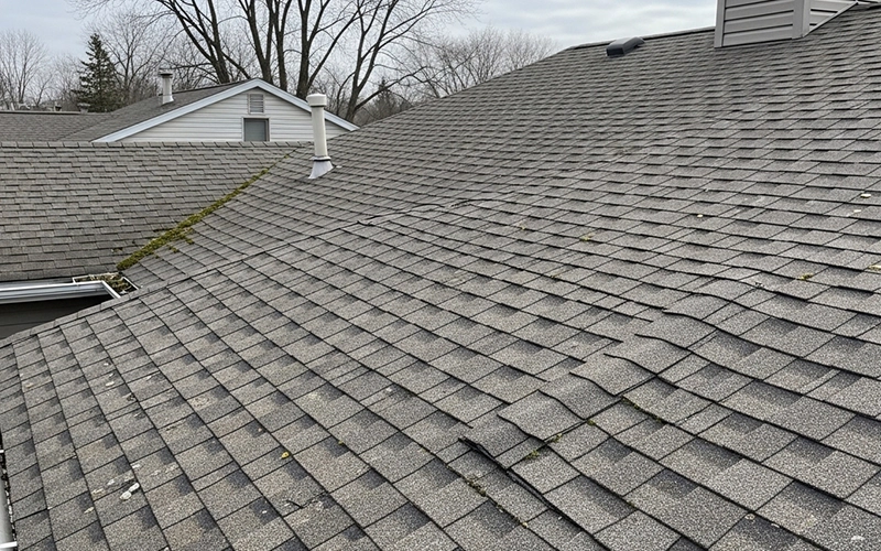 Asphalt shingle roof on a Wisconsin home showing normal aging