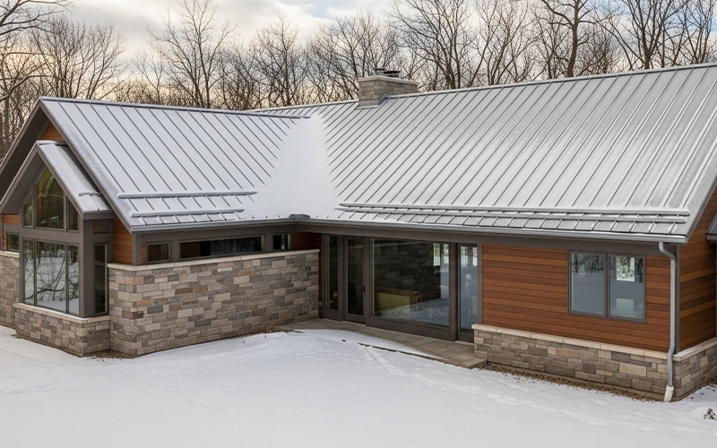 Standing seam metal roof on a Wisconsin home in winter conditions.
